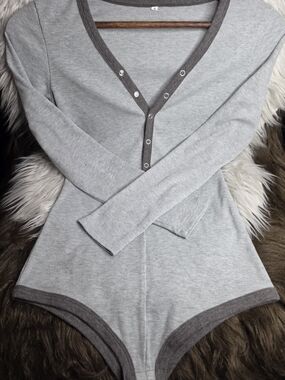 Light Gray Ribbed Long Sleeve Snap-Front Bodysuit with Dark Gray Trim